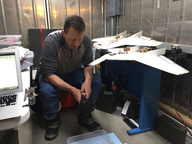 Steve checks on the temperature of the water bath we were using to provide a rough calibration for the infrared sensors carried by the planes.