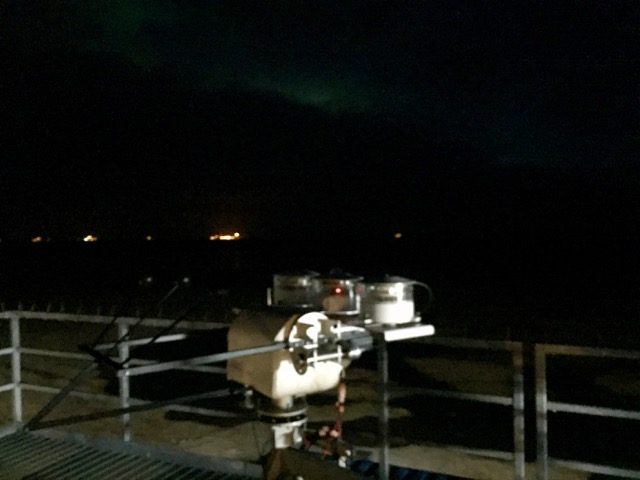 Aurora peeking through the clouds this morning over the top of the AMF-3.