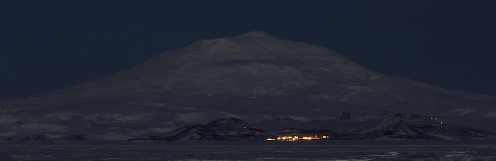 McMurdo Station and Mt. Erebus at night from the Pegasus runway. 