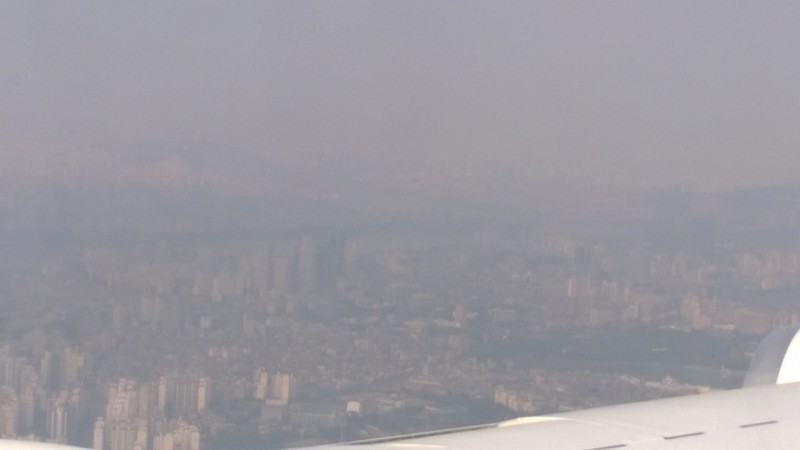 Picture of Seoul, South Korea from the NASA DC-8 during KORUS-AQ. The aerosols in the air reduce the visibility over the city.