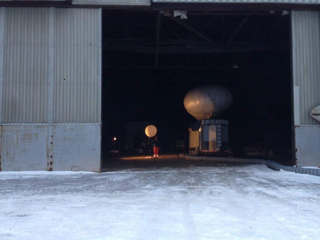 Al Bendure prepares a small balloon in the hangar.
