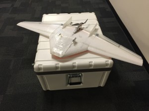 The Datahawk 2 UAS, and the shipping case used for transport of 5 aircraft and ground station equipment.