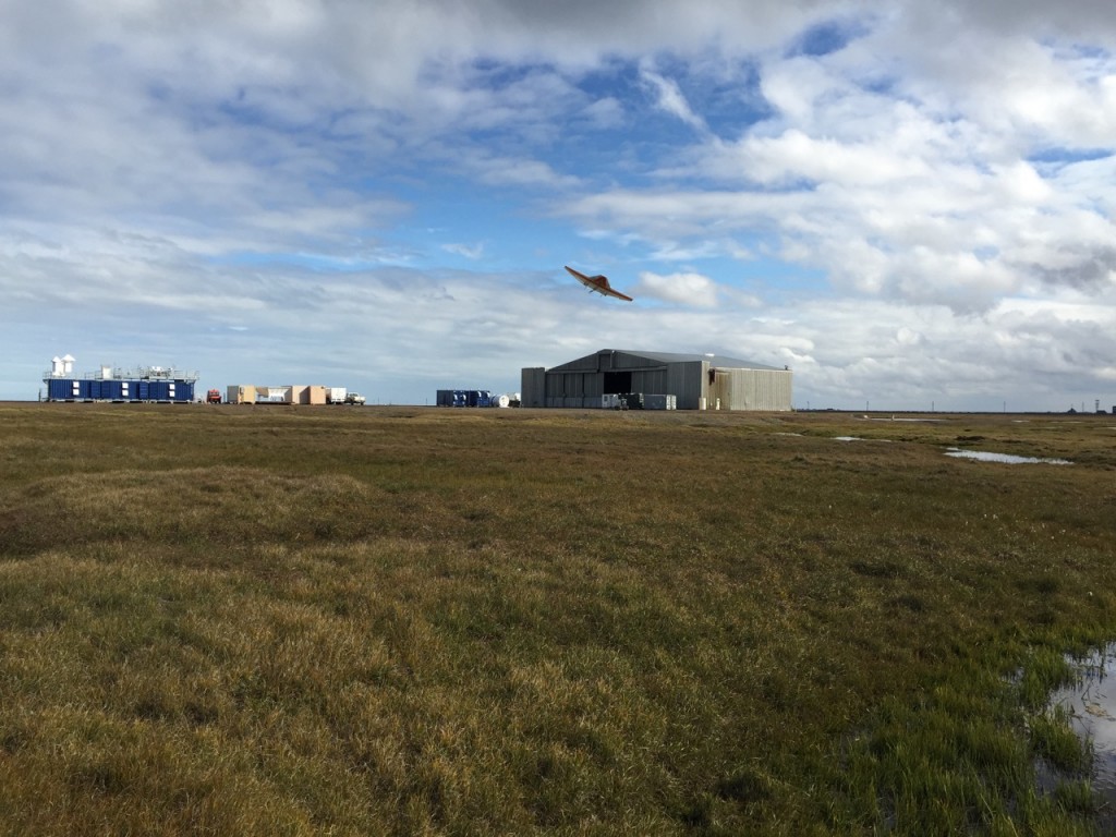 The DataHawk 2 preparing to land, with the AMF3 and hangar in the background.