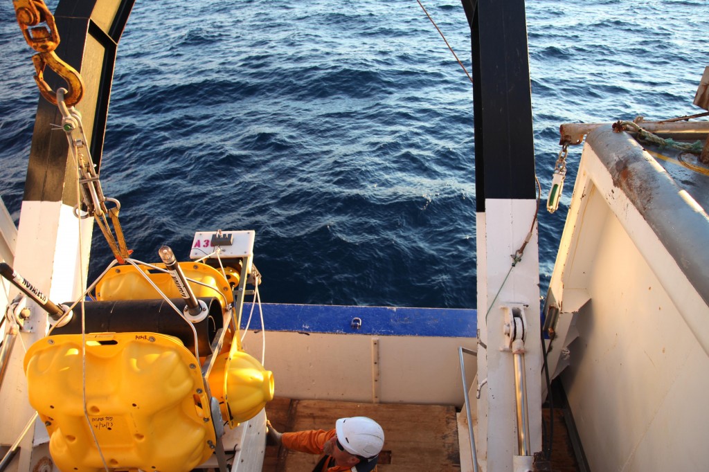The crane lifts the seismometer + absolute pressure gauge and throws it overboard