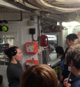 Third engineer Sue shows the ship's engine.