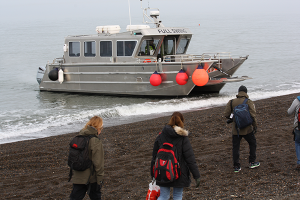 The small boat used for transferring people and cargo.