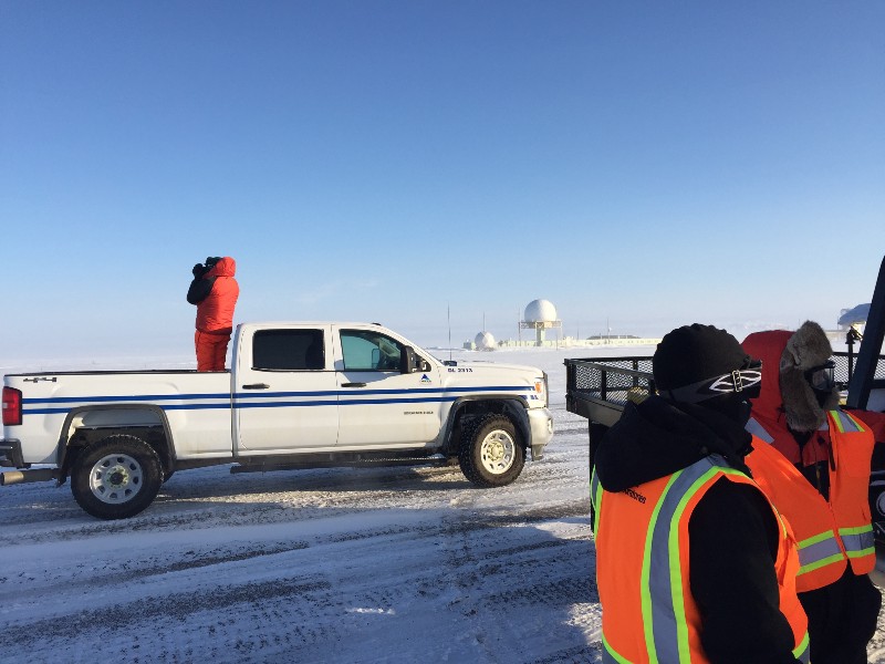 Sandia’s Al Bendure (in truck bed) keeps an eye out for bear activity while the team gears up for DataHawk flights. While it looks pretty nice and sunny, the winds were whipping at around 30 mph and snow was drifting pretty substantially! 