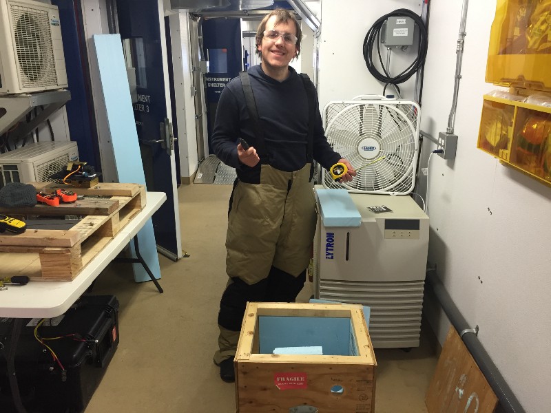 Phillip working to prepare an insulated box for operation of the POPS aerosol sampler on the roof of the AMF-3. 